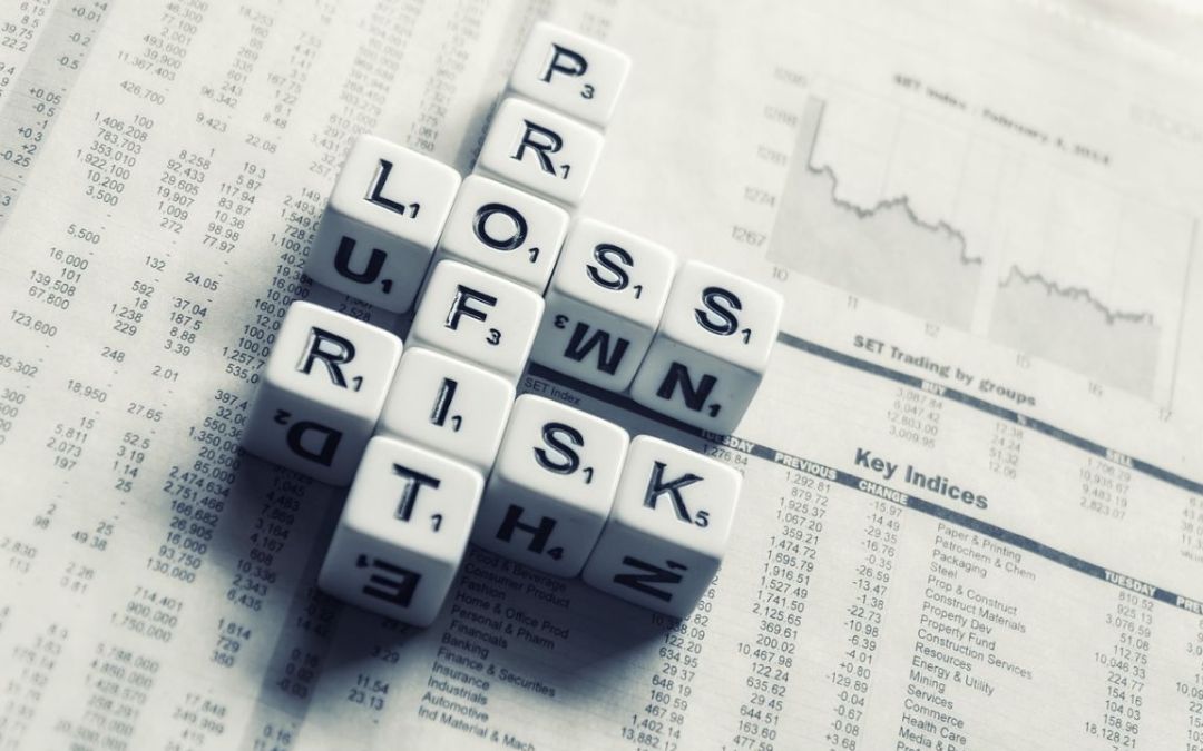 Dice spelling risk profit loss on newspaper stock report background