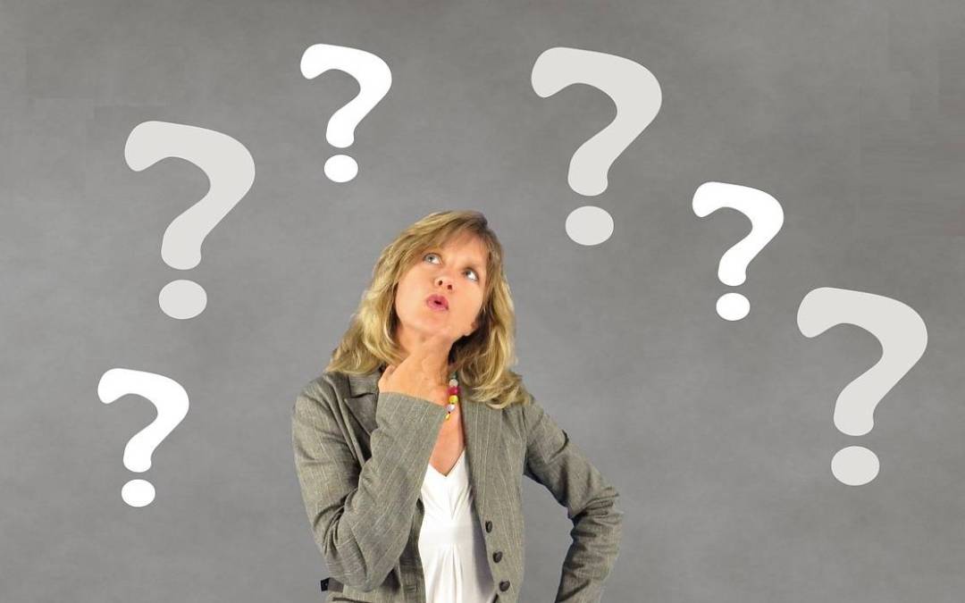 Photo of woman surrounded by 6 question marks signifying 6 important questions