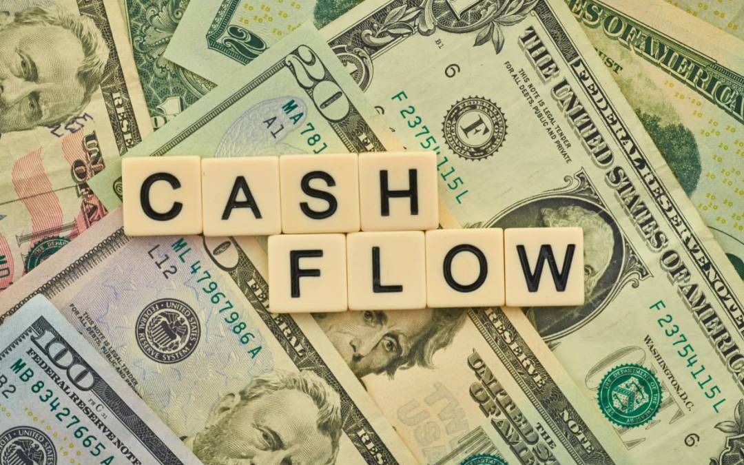 photo of US Dollar notes with tiles saying cash flow on top